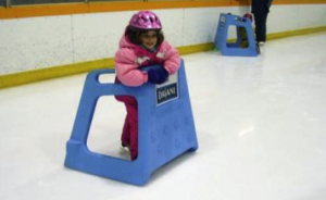 young child using the Skate Helper skating aid