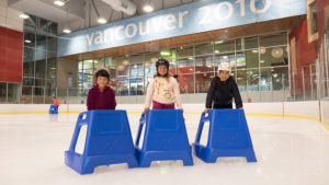 Ice skating with skate helper aid at Hillcrest Arena in Vancouver, BC